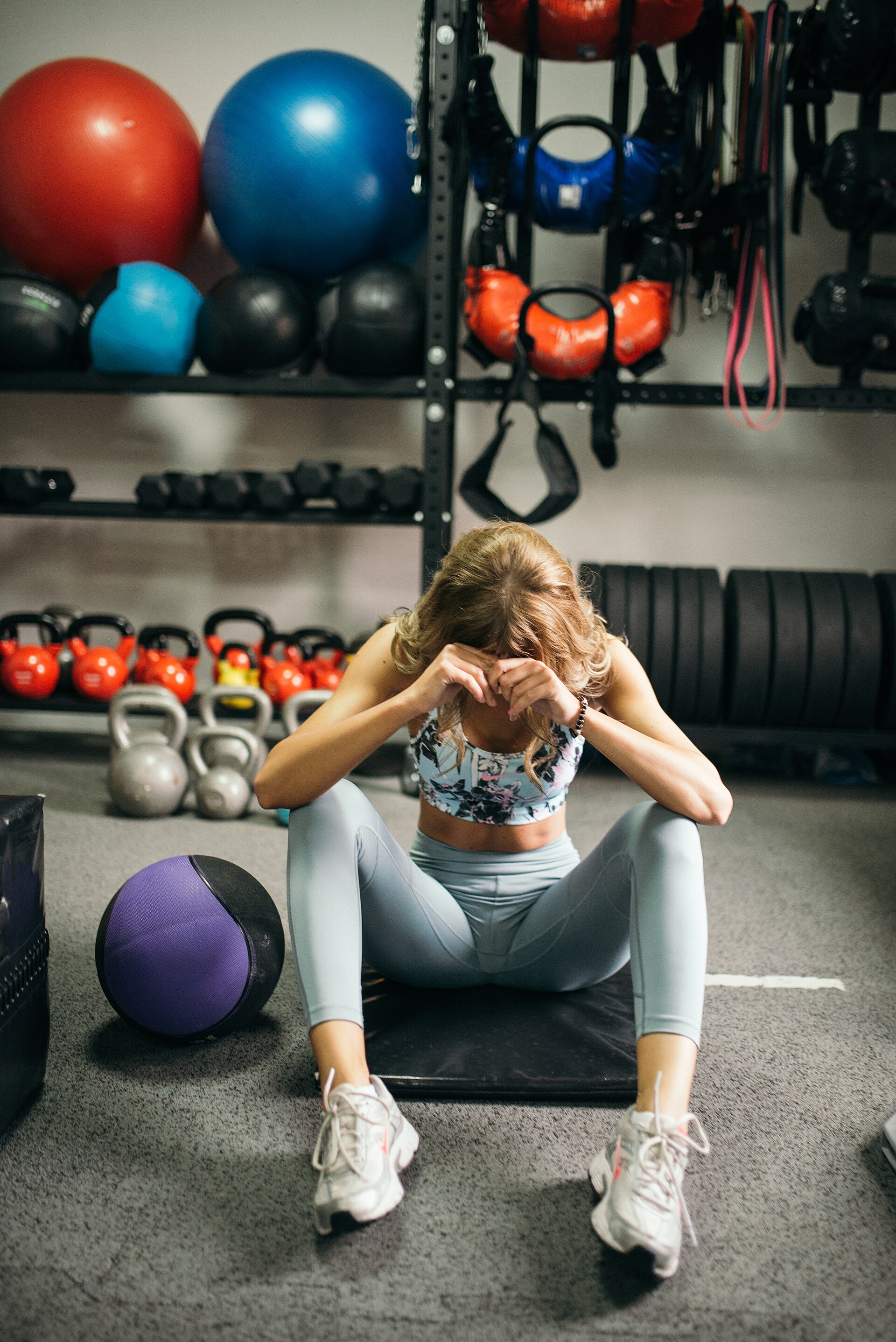 Athlete standing in a gym between training sets.